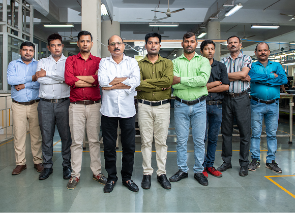 The Foot On Shoes production team on the factory floor