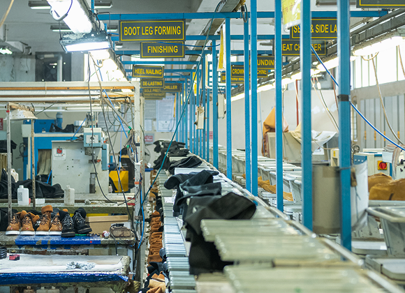 Boot leg forming and finishing stations on the Foot On Shoes production line